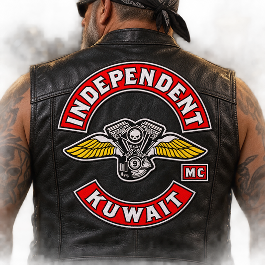 Large solid center emblem on vest back shown for a custom motorcycle club patch system in garage portrait.