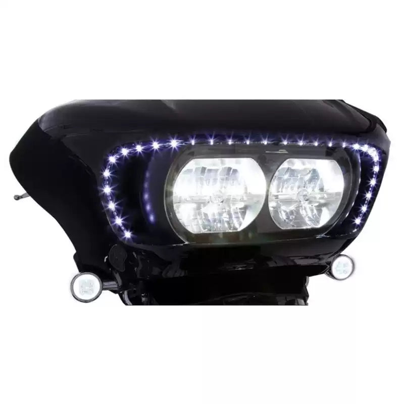 White LED headlight outline strip illuminated around a Harley Road Glide dual headlight