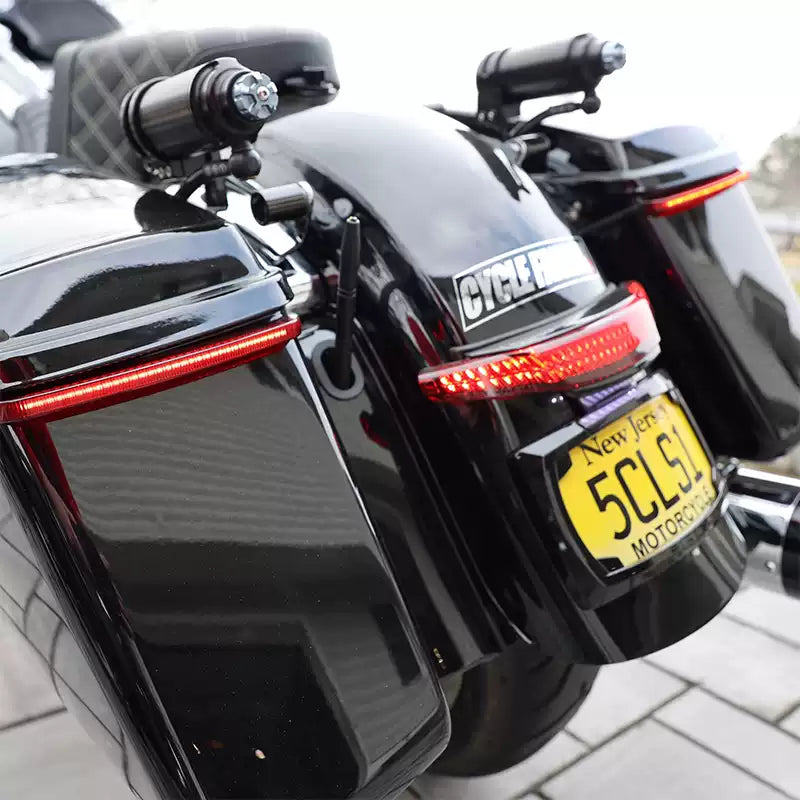 Close-up of Ciro curved saddlebag LED light bar on a Harley motorcycle