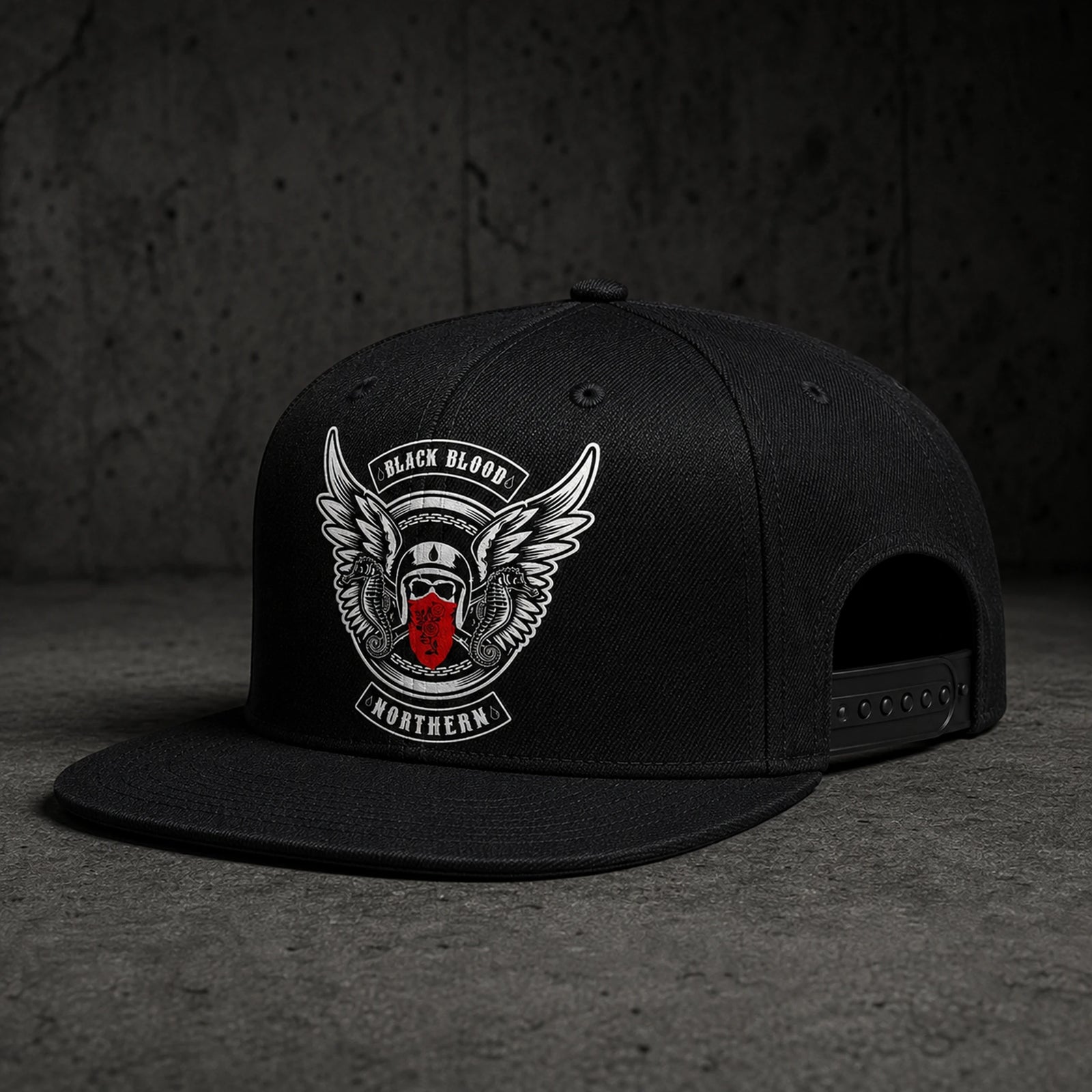 A black custom motorcycle club snapback cap has a structured crown, straight flat visor, and adjustable closure.