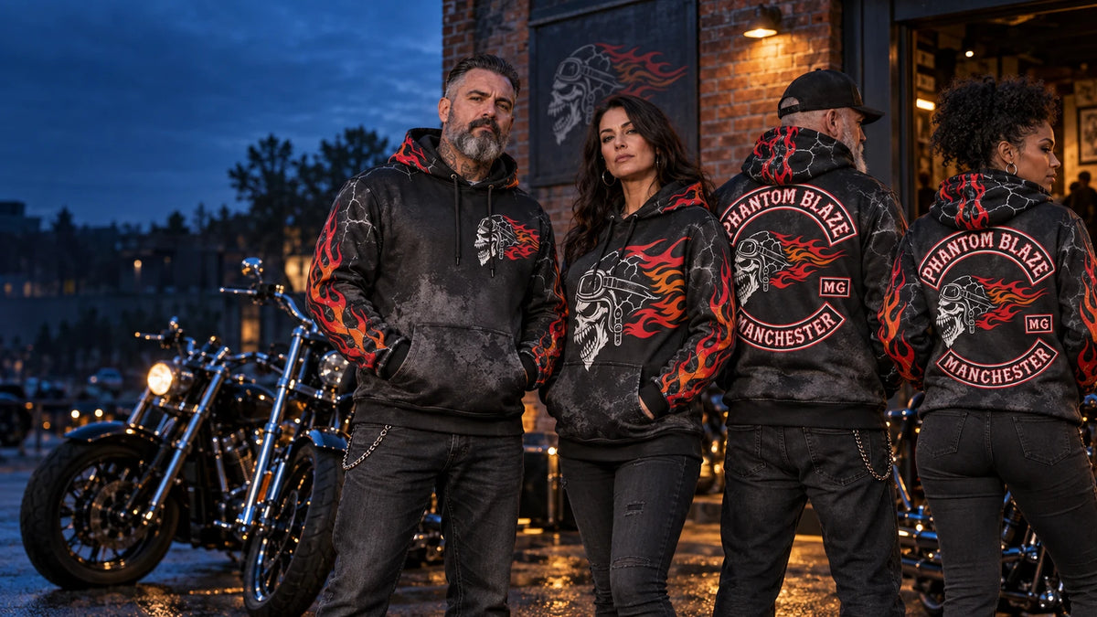 Motorcycle club members displaying the front and back of custom black and charcoal all-over print hoodies outside a clubhouse.
