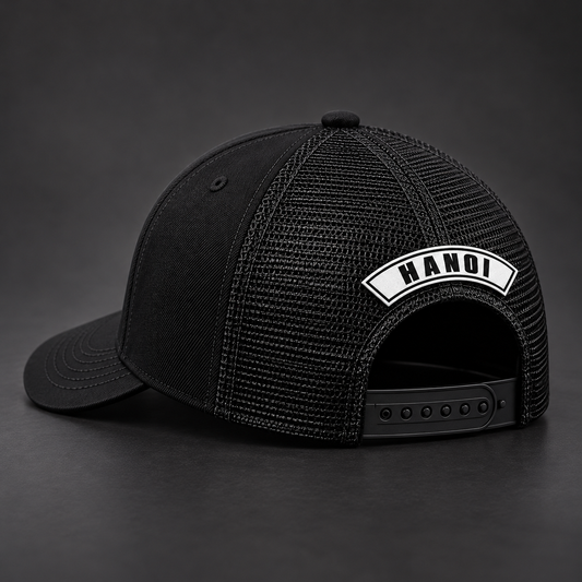 Rear view of the same black River Jackals trucker hat with only the Hanoi chapter rocker.