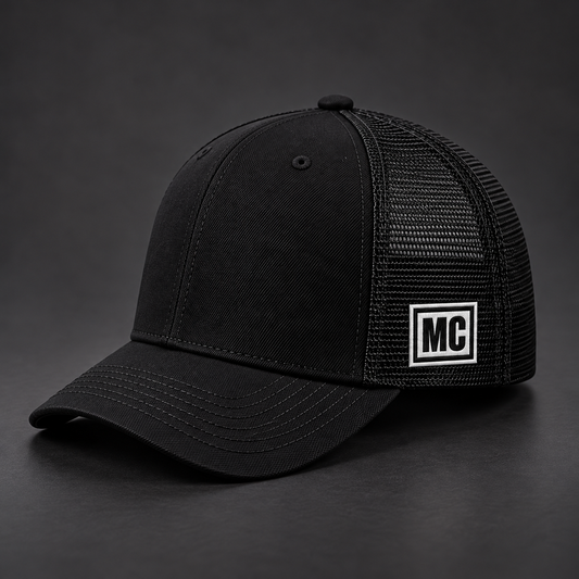 Side view of the same black River Jackals trucker hat with only a small MC tab.
