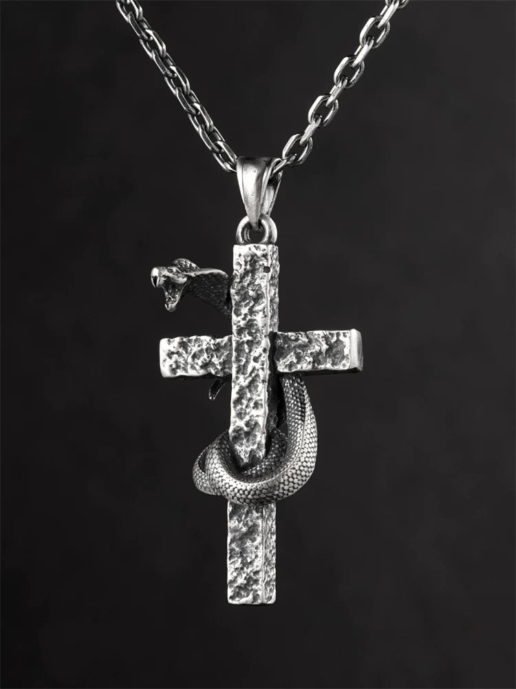 Cobra cross sterling silver pendant displayed on chain