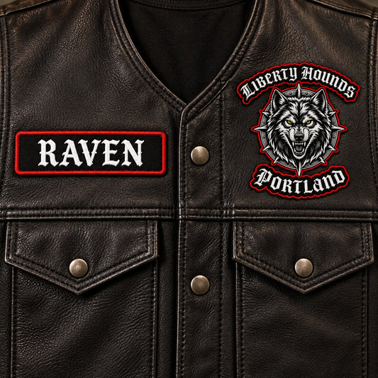 Rectangular embroidered road-name bar with fictional neutral lettering for a motorcycle club, shown at black leather vest front panel.