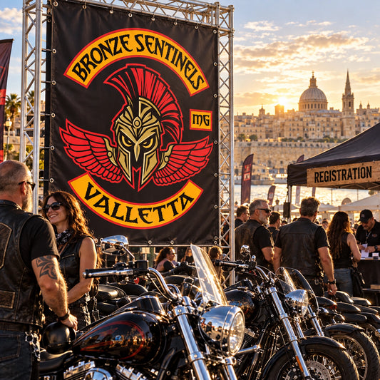 A large custom motorcycle club banner creating a strong entrance at a crowded rally.