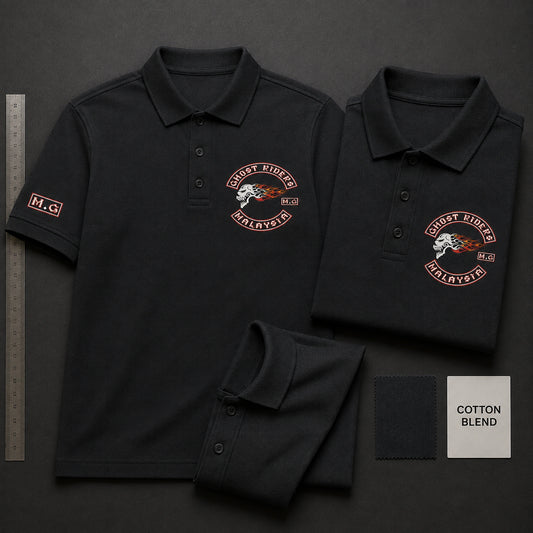 Charcoal Ghost Riders polo samples on a test table show a left chest emblem, sleeve detail, recovering collar and placket, and a label reading cotton blend.