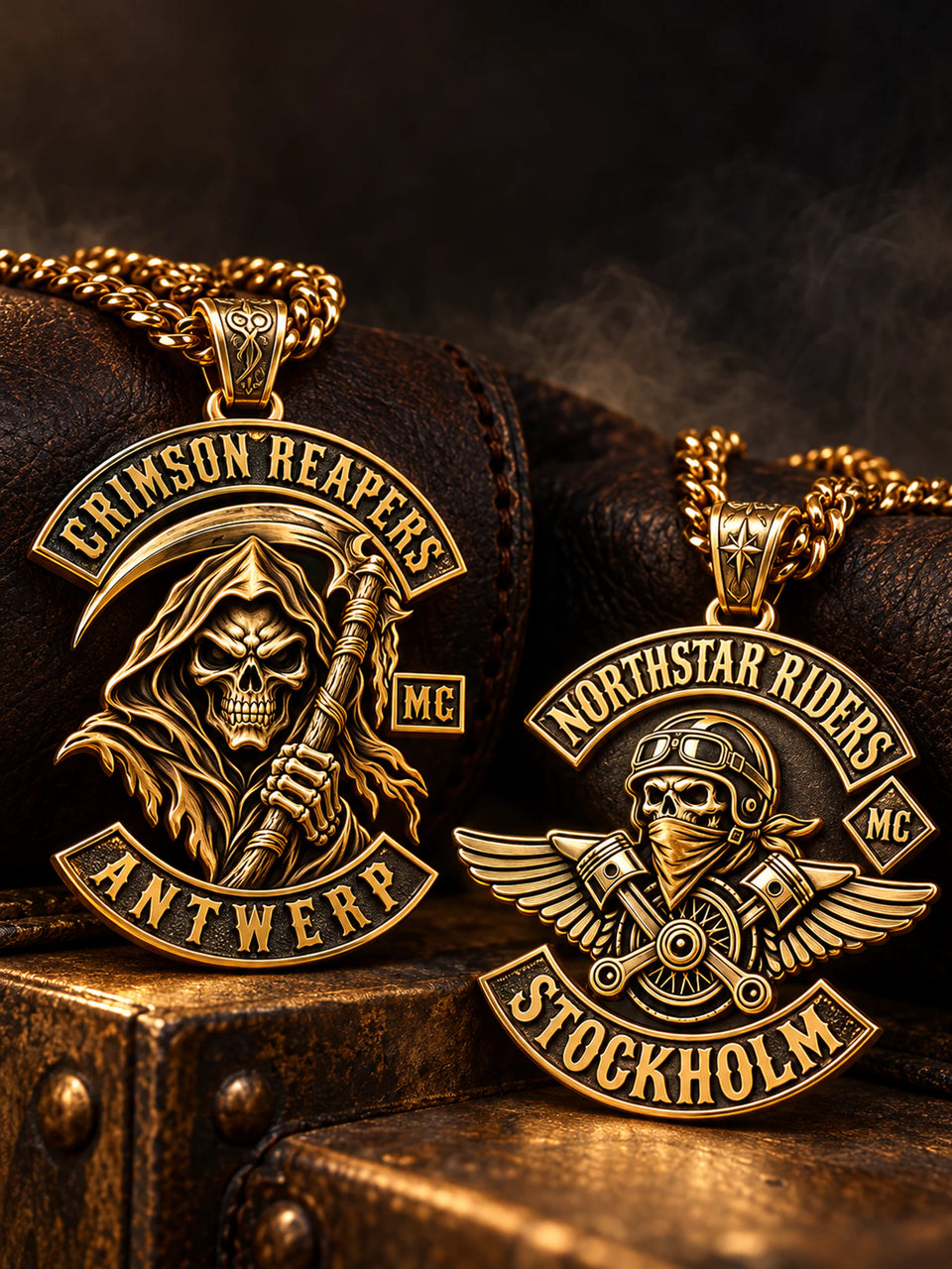 Two custom 18K gold-plated motorcycle club pendant concepts arranged for a mobile hero.