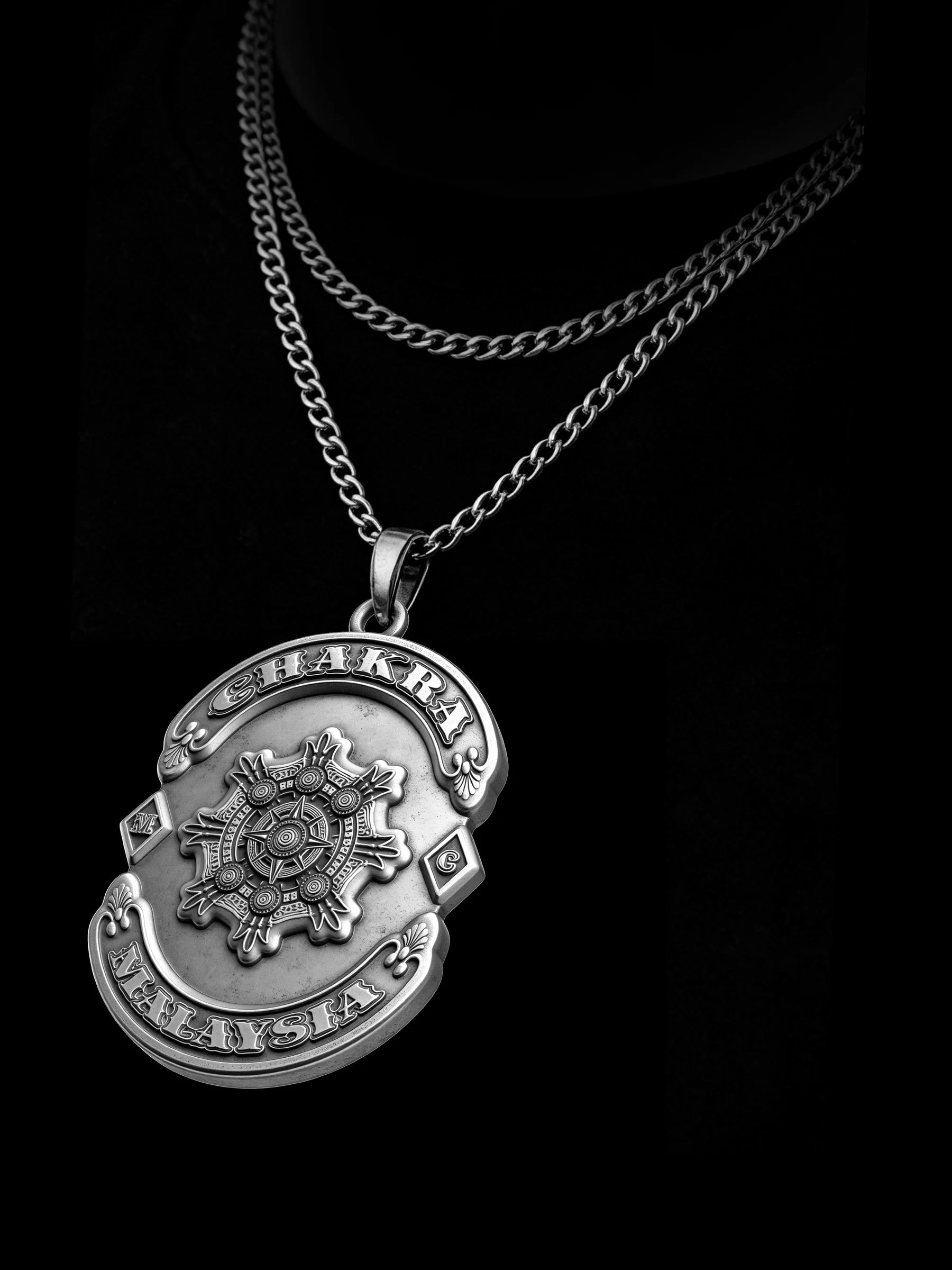 Custom chakra wheel motorcycle club pendant craftsmanship reference, raised relief detail