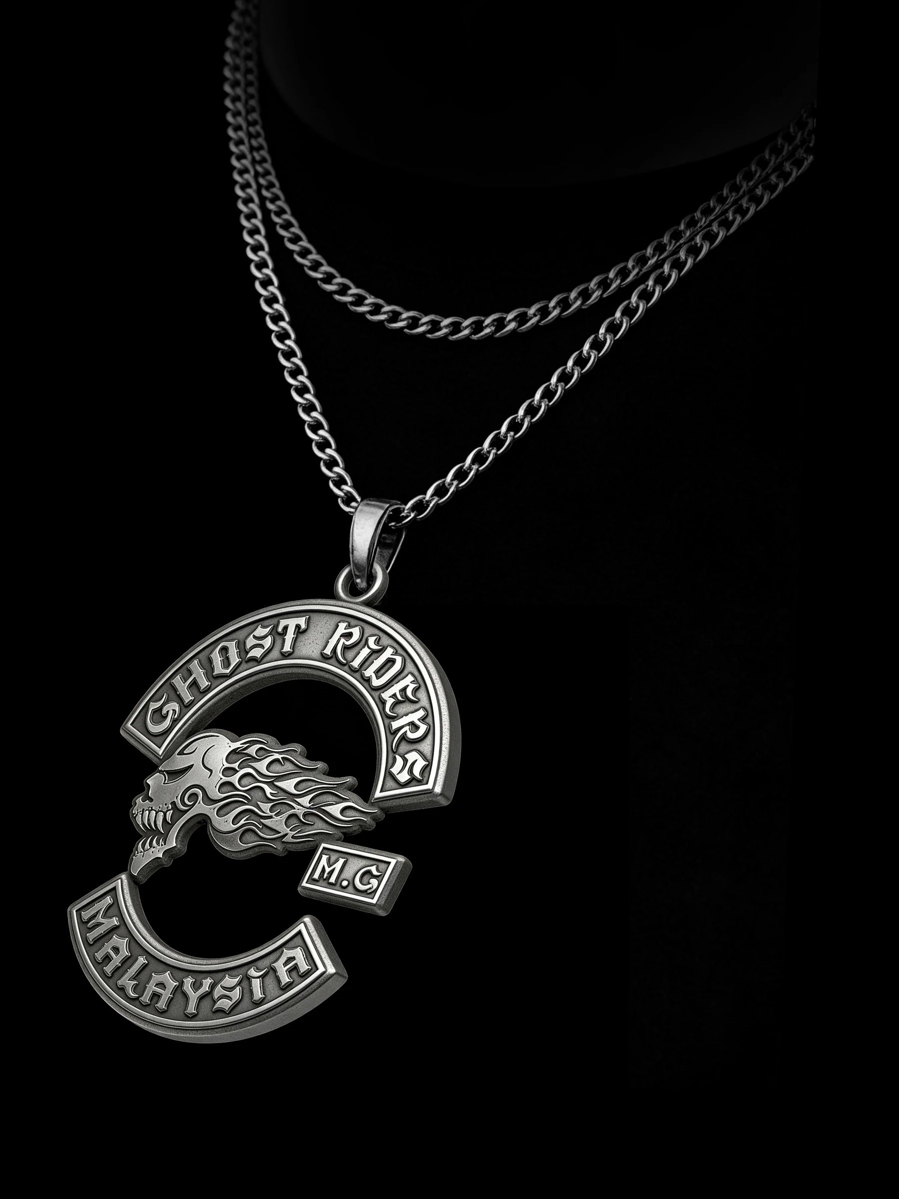 Custom flaming skull motorcycle club pendant craftsmanship reference, raised relief detail