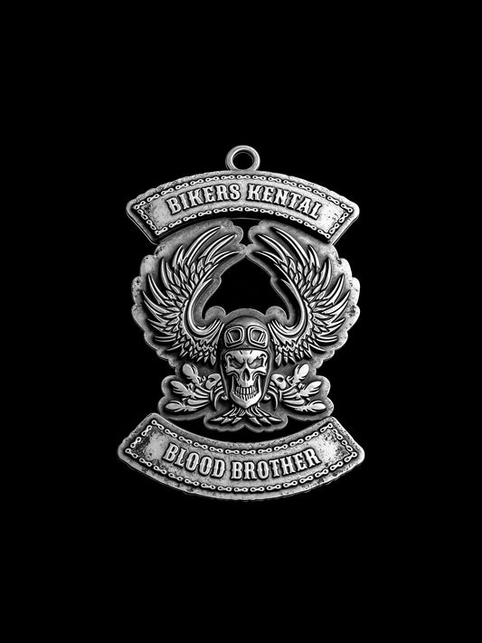 Custom flaming winged skull motorcycle club pendant craftsmanship reference, front view