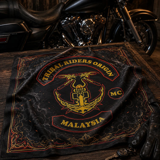 Detailed full-color motorcycle club bandana featuring the authorized Tribal Riders Origin Malaysia MC logo on a walnut clubhouse table beside a black V-twin touring motorcycle.