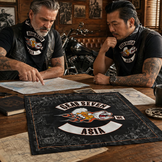 Custom motorcycle club bandana featuring the authorized gear seven mc identity in clubhouse meeting with members gathered around route maps and one finished bandana centered on the table.
