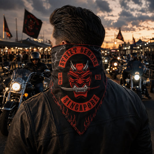Custom motorcycle club bandana featuring the authorized Street Demons MC identity in large motorcycle rally at dusk with tents, flags, headlights and a rider wearing the featured bandana.