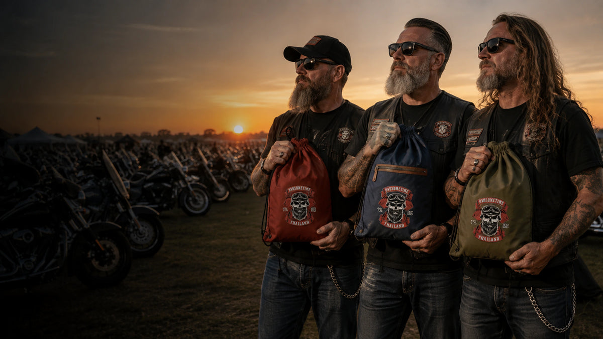Three motorcycle club riders hold realistically sized custom drawstring bags at a rally.