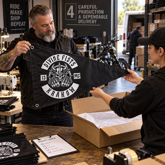 A custom motorcycle club triangle flag passes final inspection before being boxed for delivery.