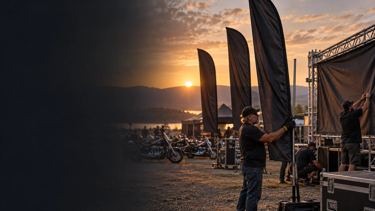 Custom motorcycle club flags and event gear at an outdoor gathering