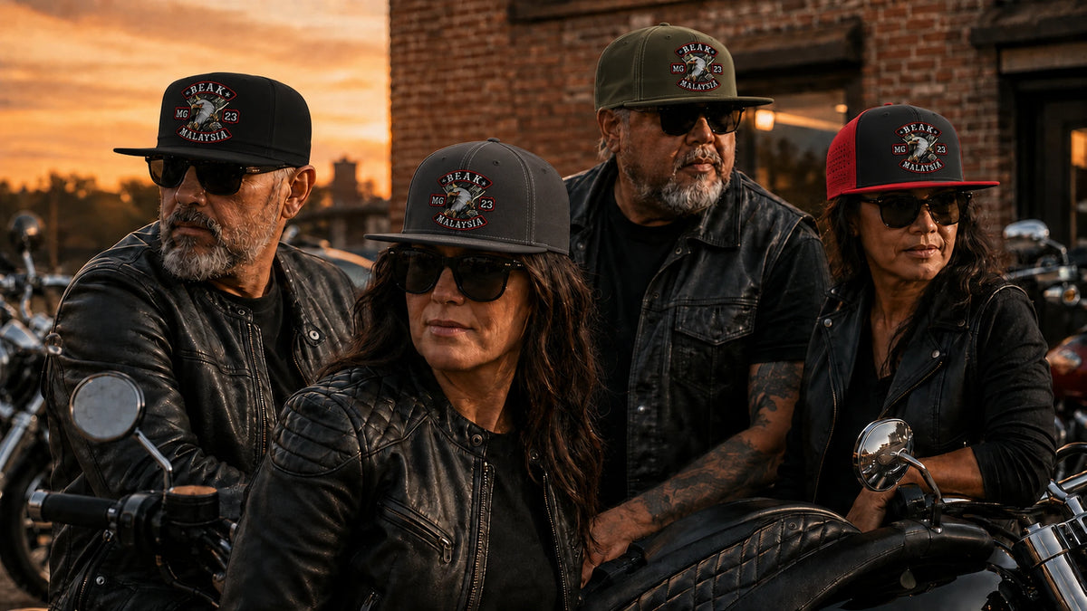 Mature motorcycle-club riders wear distinct custom flat-brim caps outside a clubhouse with straight visors visible.