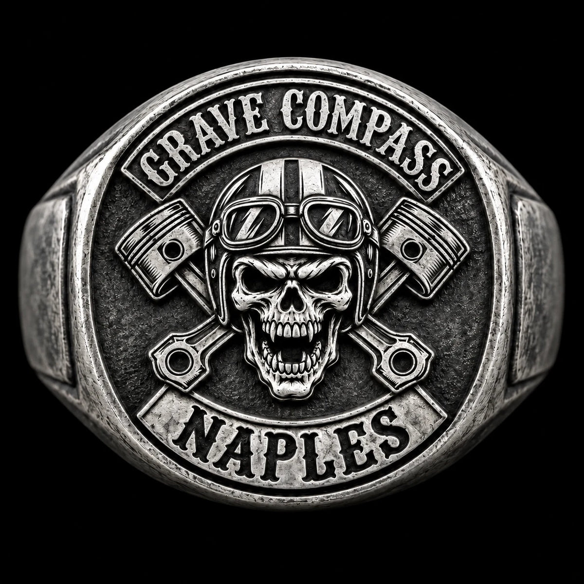 Front view of the same antique white copper Grave Compass motorcycle club ring showing the club emblem centered on the ring face.