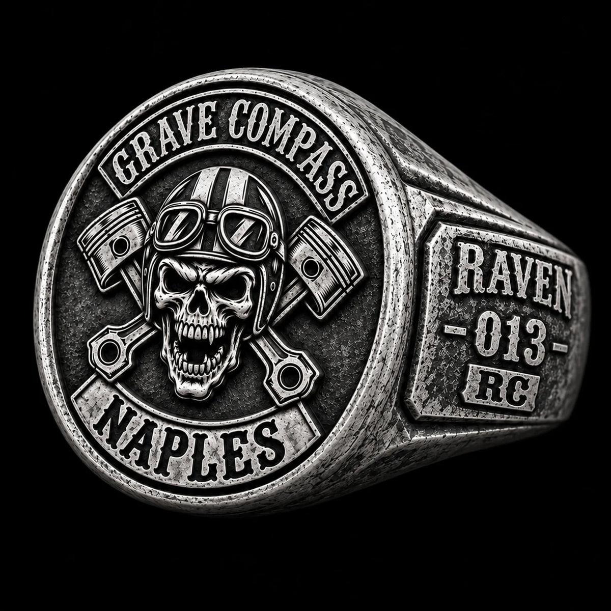 Right-side view of the same antique white copper Grave Compass motorcycle club ring showing a road name and member number on the shoulder.