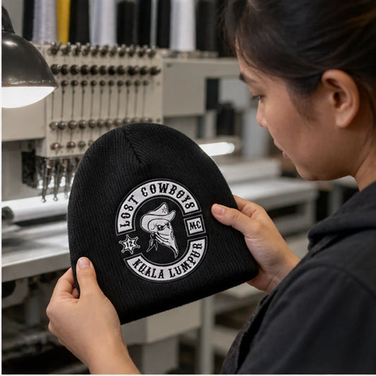 Custom club caps, beanies and rider accessories with an authorized motorcycle club logo shown during custom design review
