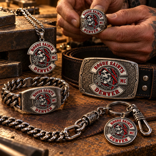 Custom motorcycle club jewelry and metal gear engraved with an approved club logo on an artisan workbench.