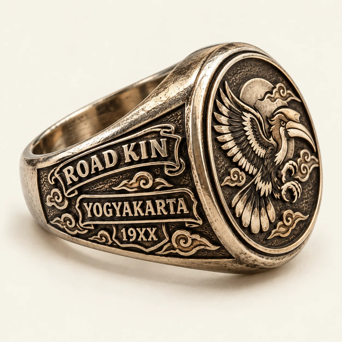 Left-side view of a white copper Road Kin motorcycle club ring showing chapter and founding-year engraving on the shoulder.