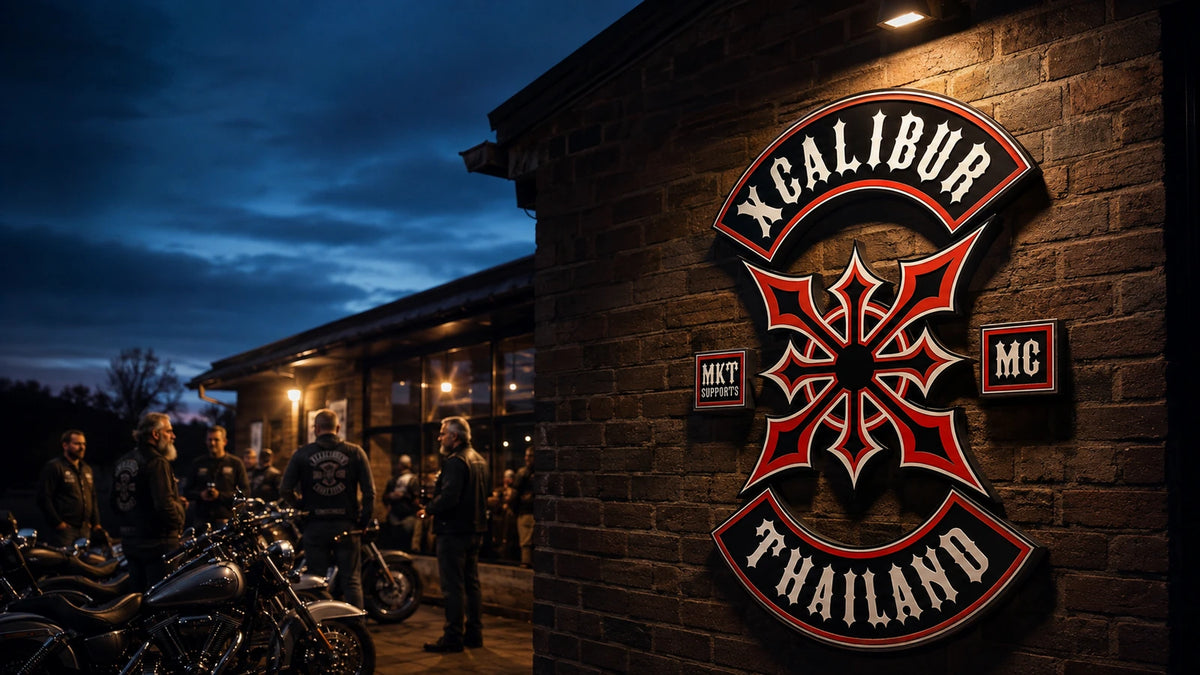 Custom motorcycle club metal sign with an approved club logo displayed inside a brick clubhouse.