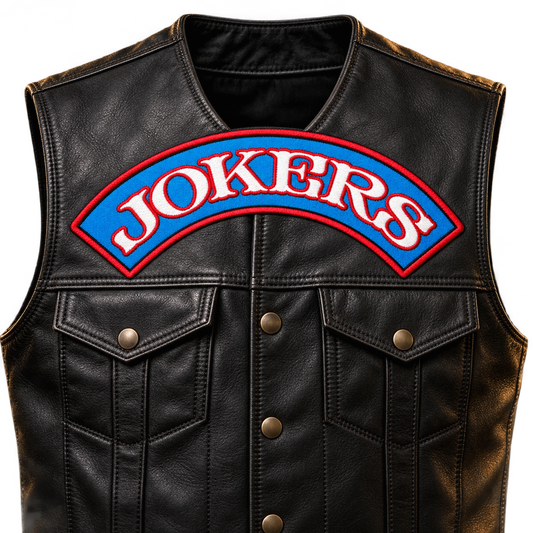 Solid embroidered road-name bar shown for a custom motorcycle club patch system in front vest close-up.