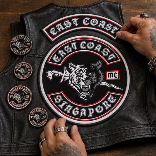 Custom club patches, rockers, pins and badges with an authorized motorcycle club logo arranged for customization planning