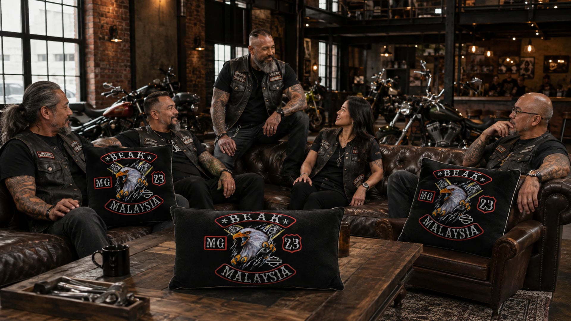 Custom motorcycle club pillows and cushions with a club logo displayed inside an American V-twin motorcycle clubhouse.