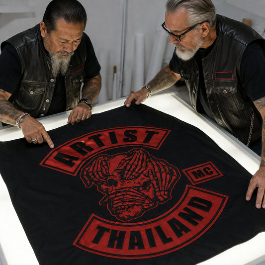 A club president and designer inspect a full-size custom flag proof before production approval.