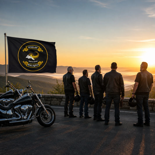 Motorcycle club riders stand respectfully beside a custom memorial flag at a quiet dawn overlook.