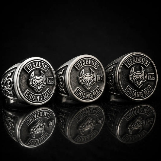Three matching custom motorcycle club rings showing polished silver, brushed silver and dark oxidized finish options.