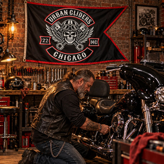 Classic swallowtail flag displayed in a private motorcycle garage for a motorcycle club.