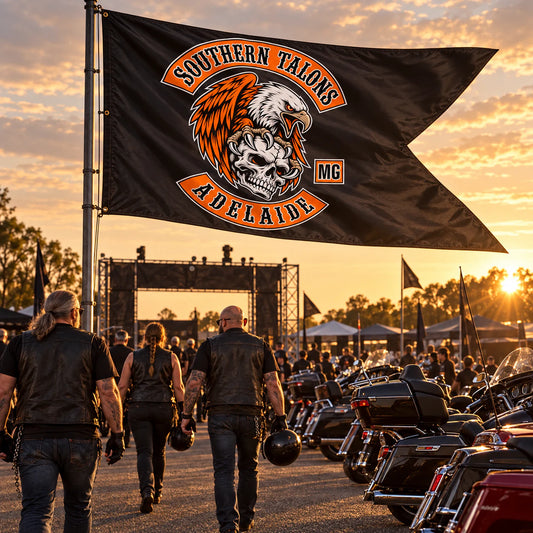 Oversized custom swallowtail flag marking a motorcycle rally entrance for a motorcycle club.