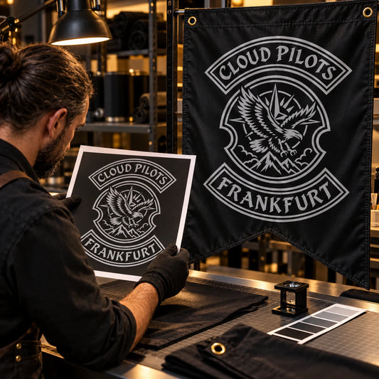 Print specialist matching authorized club artwork to a custom flag for a motorcycle club.