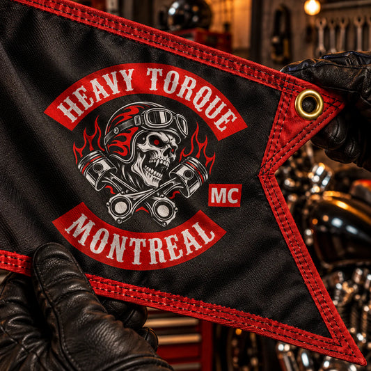 Close inspection of durable fabric, stitching and hardware on a swallowtail flag for a motorcycle club.