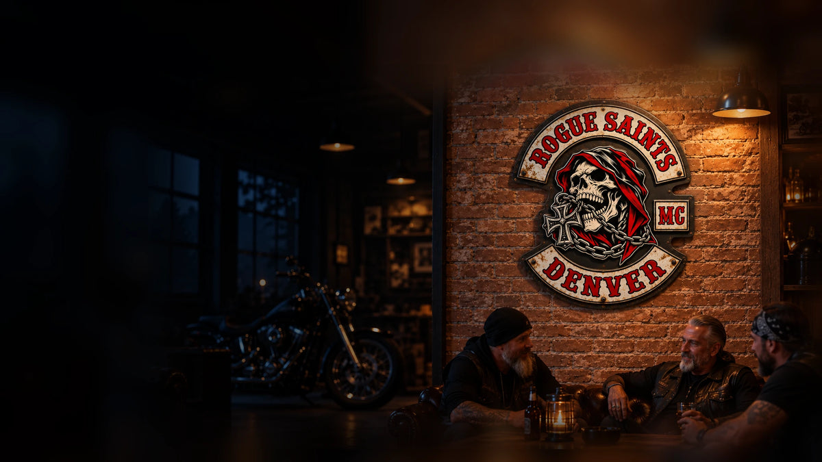 Complete custom motorcycle club tin sign displayed on a brick wall inside an American V-twin clubhouse.