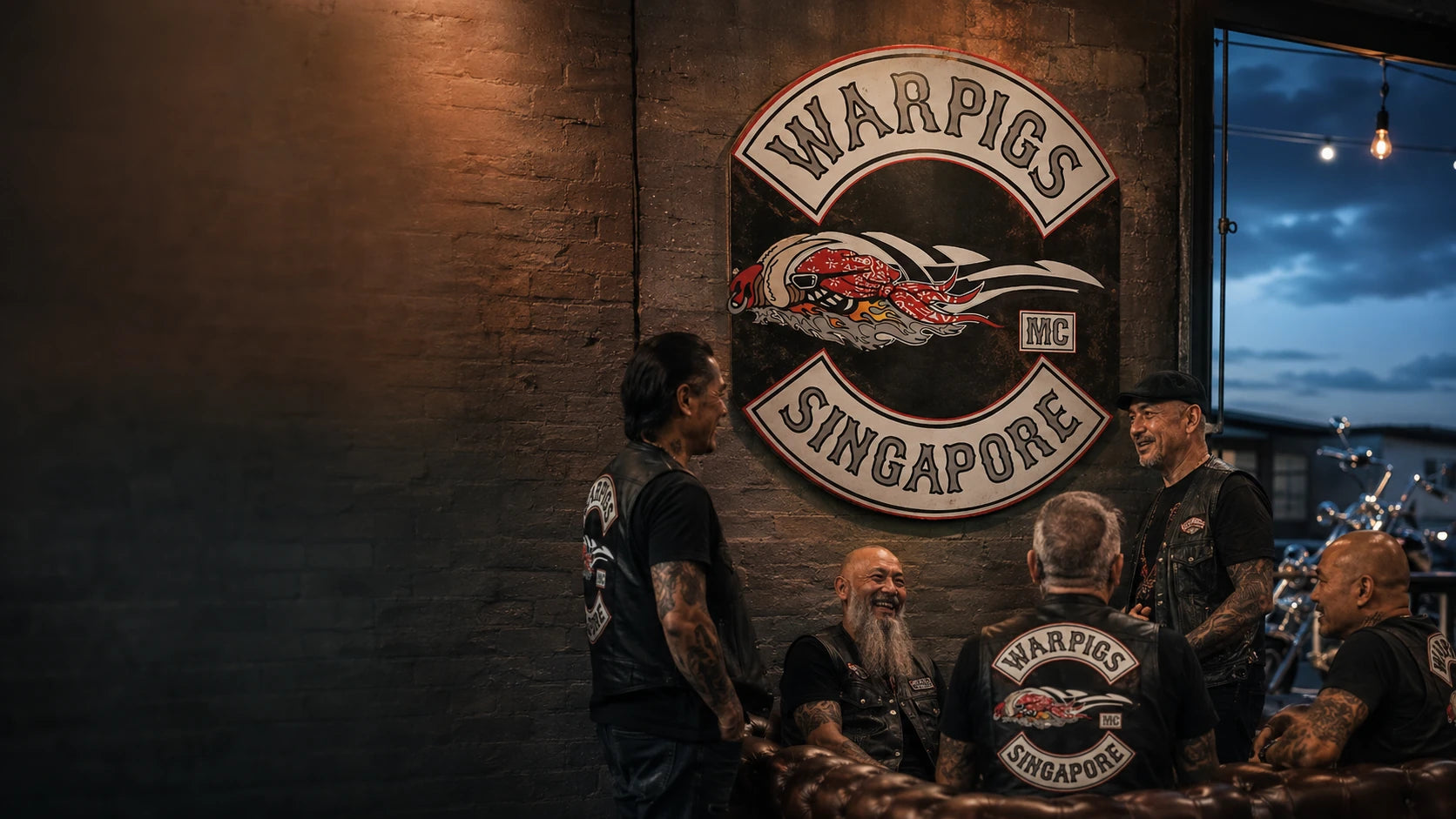 Custom motorcycle club tin signs and wall art displayed inside an American V-Twin motorcycle clubhouse.