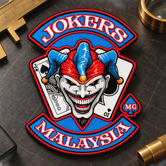 Solid custom-shape embroidered emblem patch shown for a custom motorcycle club patch system in cutting inspection table.