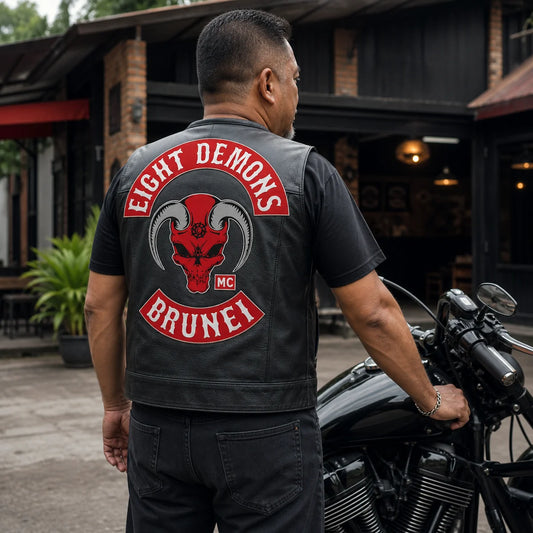Complete three-piece motorcycle club back patch set on a leather vest.