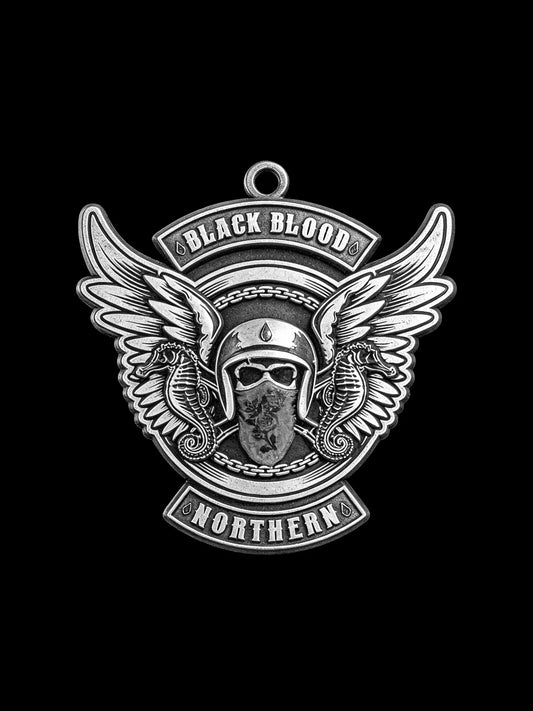 Custom winged masked rider motorcycle club pendant craftsmanship reference, front view