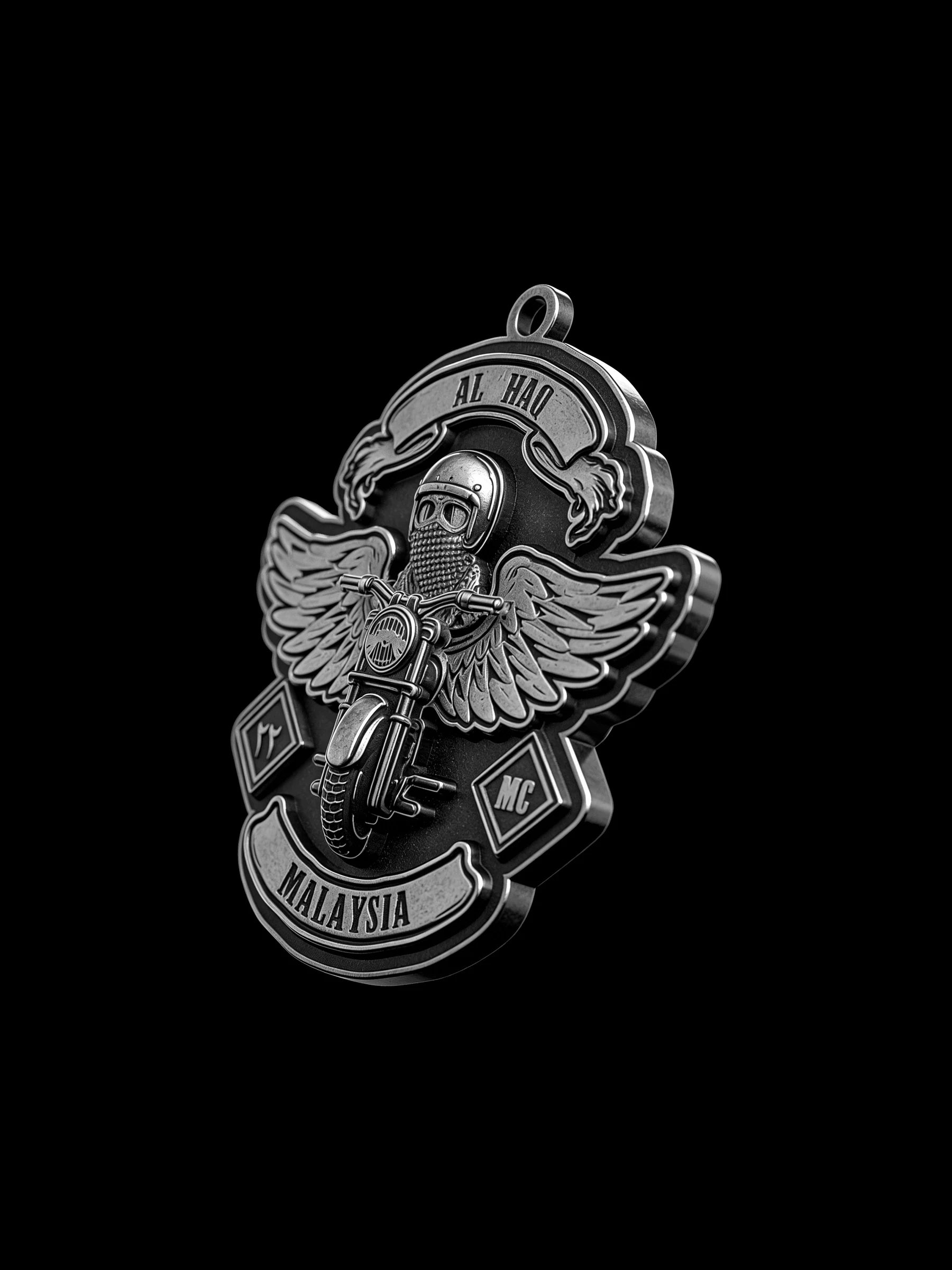 Custom winged motorcyclist motorcycle club pendant craftsmanship reference, three quarter view
