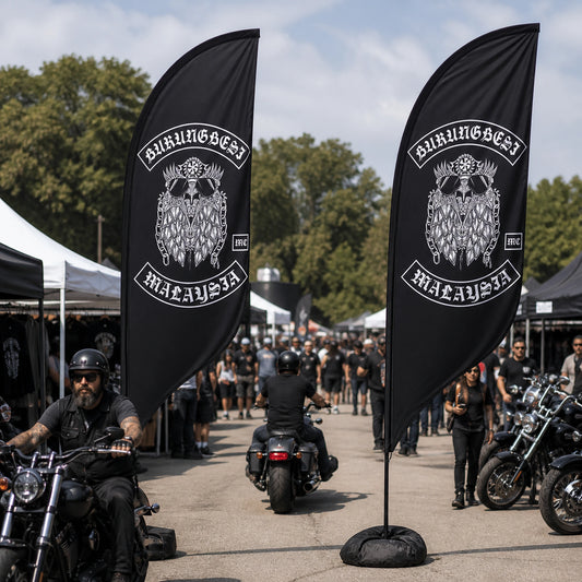 Double-Sided Feather Flags: custom motorcycle club feather flag shown in busy outdoor custom bike show with riders approaching from both directions.