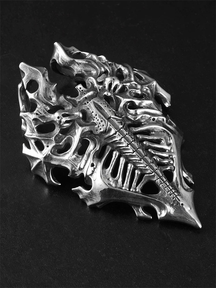 Angled view of openwork dragon skeleton shield silver pendant