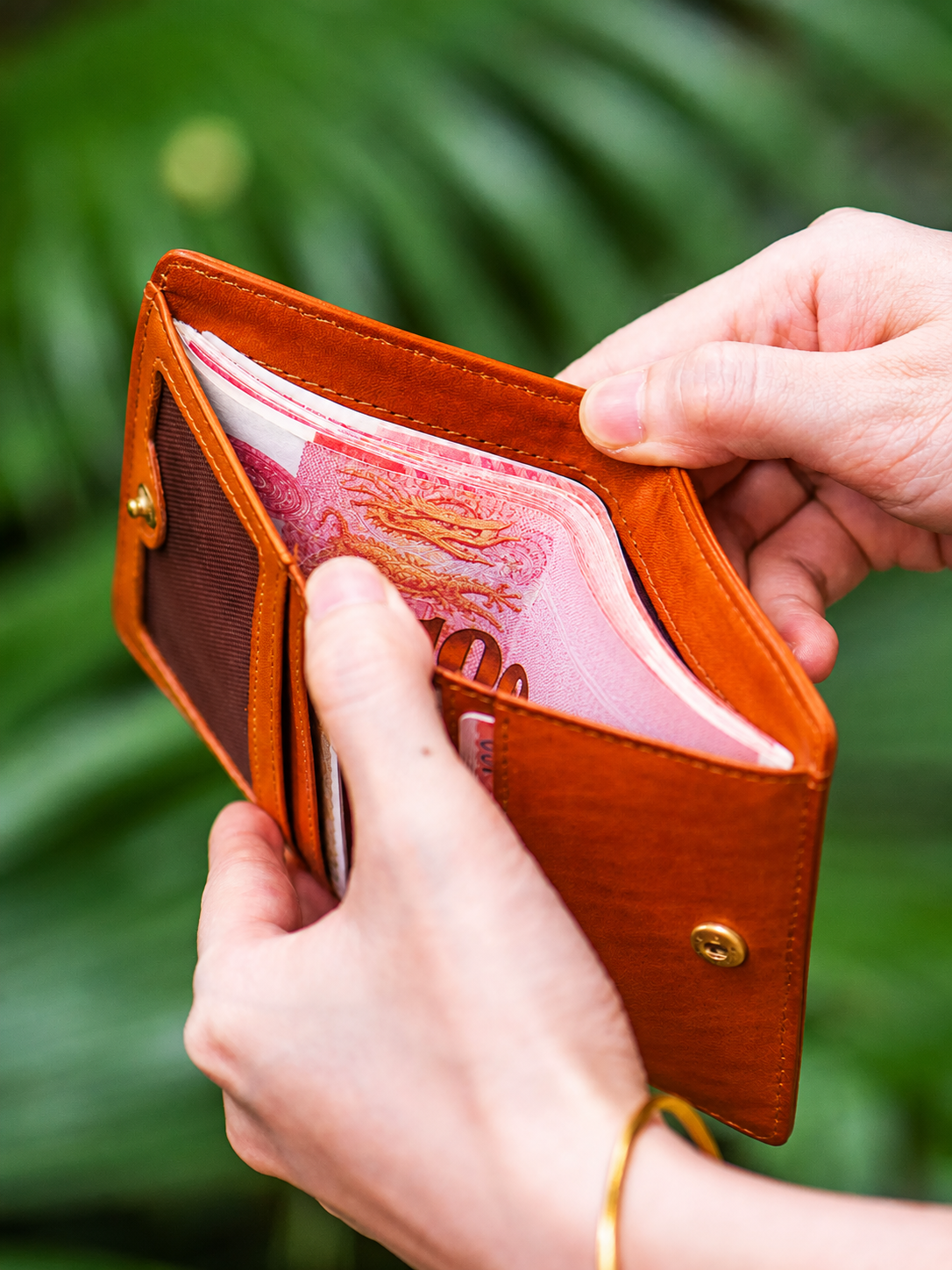 compact biker bifold wallet cash compartment in use