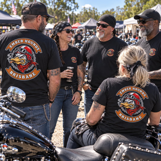 Ember Hounds riders wearing matching short-sleeve club T-shirts at a summer motorcycle rally.
