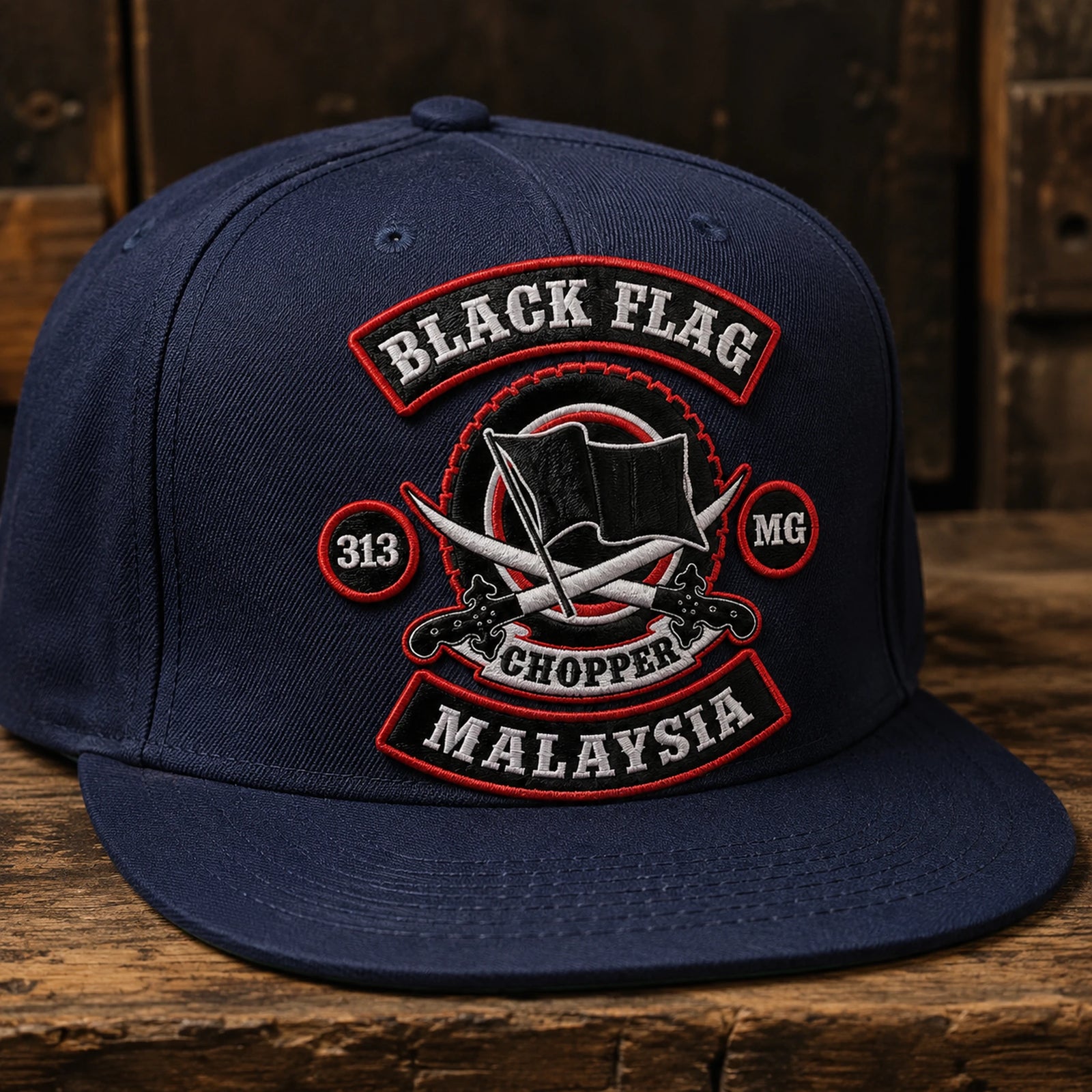 A navy motorcycle club flat-brim cap features a textured stitched embroidered patch.
