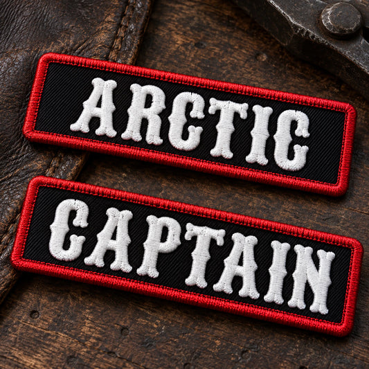 Macro product photograph of classic raised embroidery on durable twill motorcycle club name bars, showing custom motorcycle club name bar patch options.